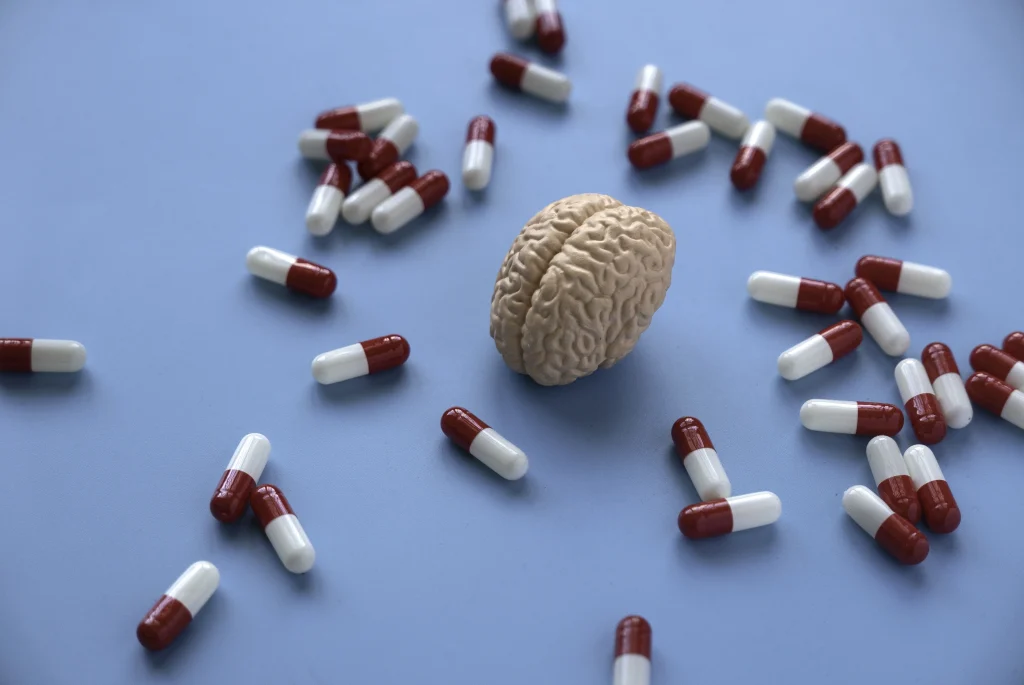 ADHD Isn't Low Dopamine: It's Dysregulated Synapses (2026 Research Explains Why) 1 human brain model with medical capsules 2026 03 16 04 35 48 utc copy